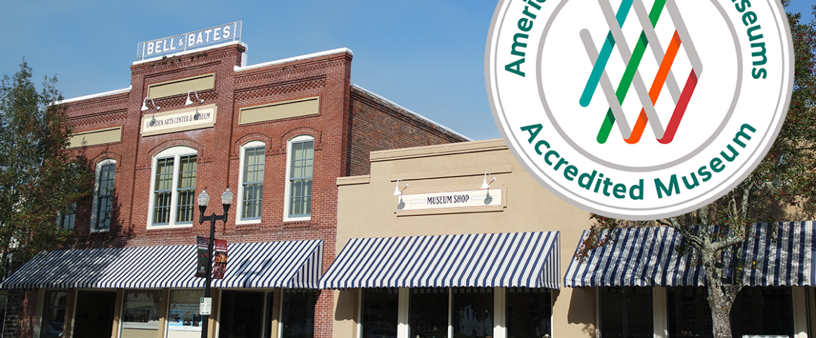 Exterior street view of the historic Gadsden Arts Center & Museum in Quincy featuring brick architecture, striped awnings, and an inset seal showing American Alliance of Museums accreditation.